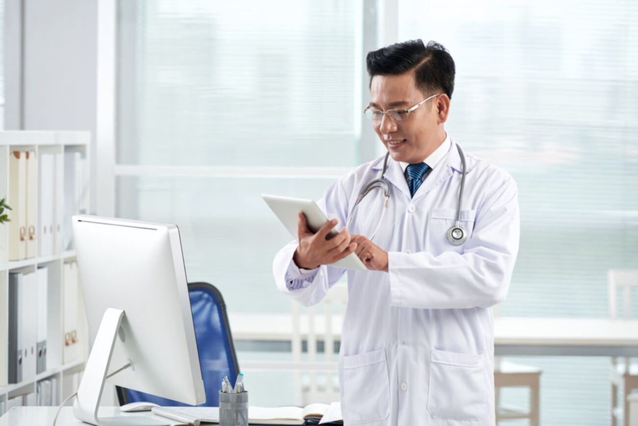 asian-doctor-using-medical-app-his-digital-device.jpg