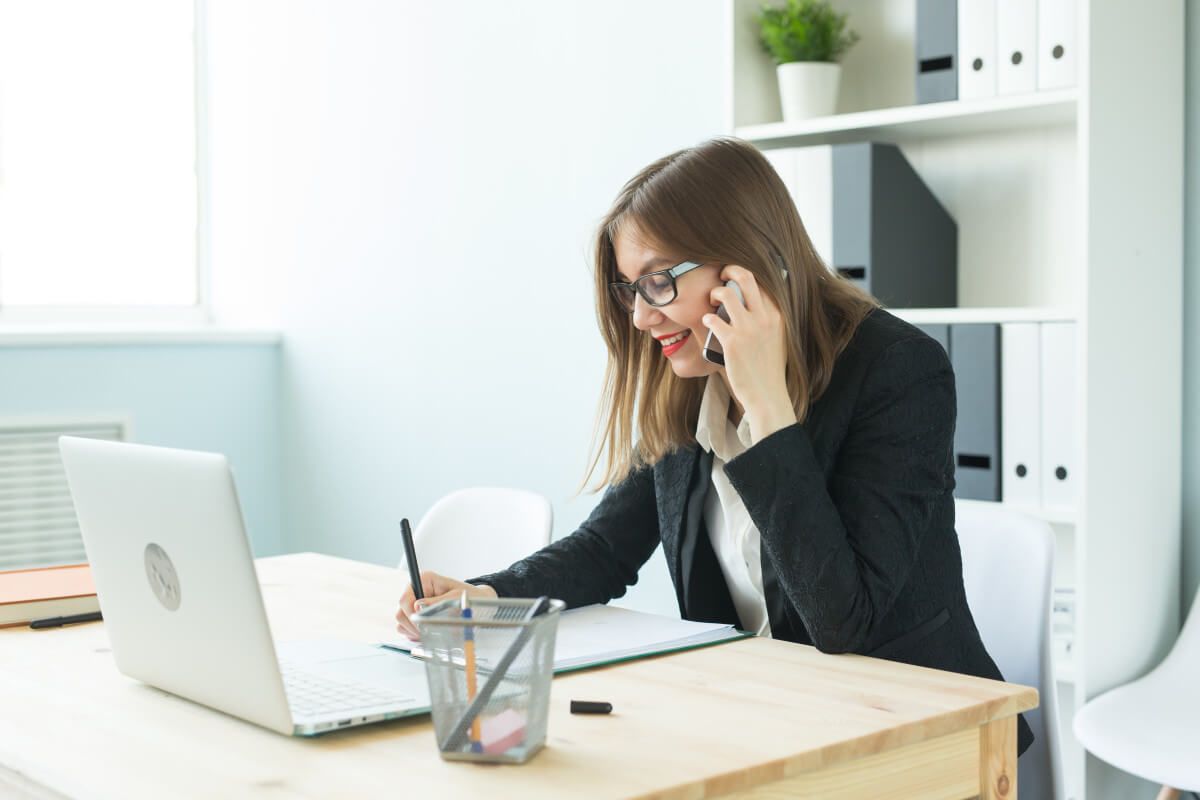 business-realtor-people-concept-attractive-woman-office-talking-phone-make-notes.jpg