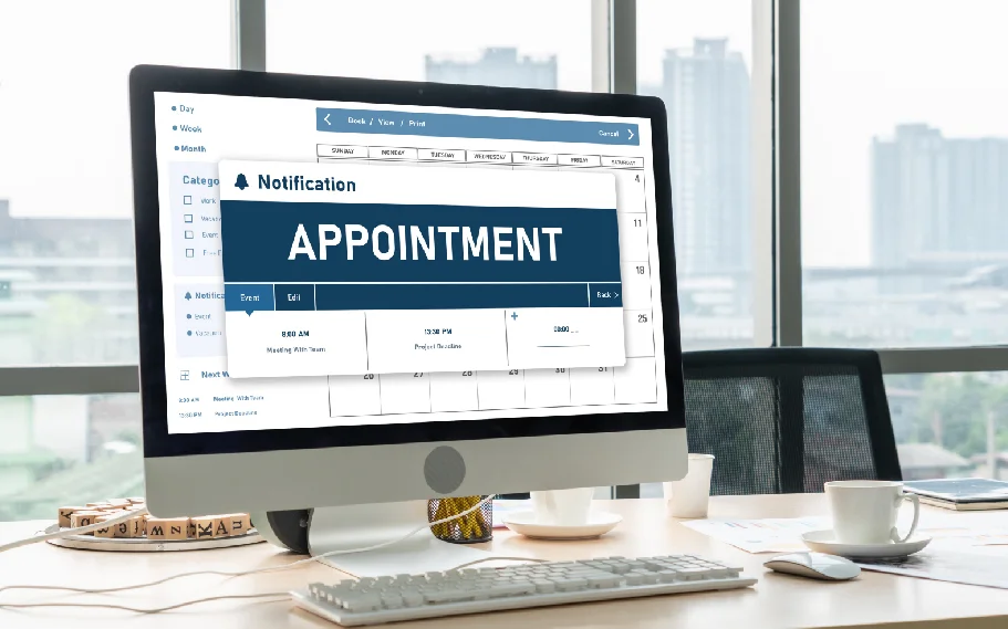 Dr. Maya Patel reviewing a website performance dashboard at Desert Bloom Family Clinic in Phoenix, with appointment availability visible on a nearby scheduling screen.