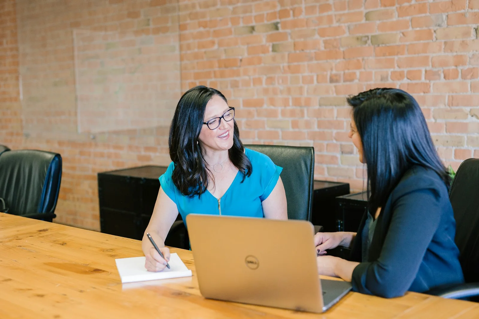 Dental practice team discussing email marketing strategy and patient data