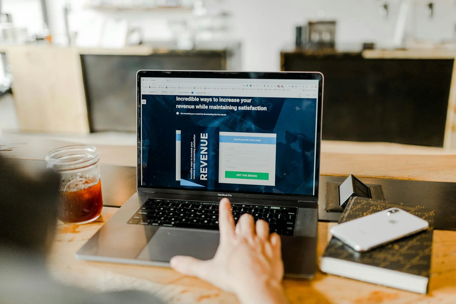 Startup founder reviewing a new website design layout on a laptop