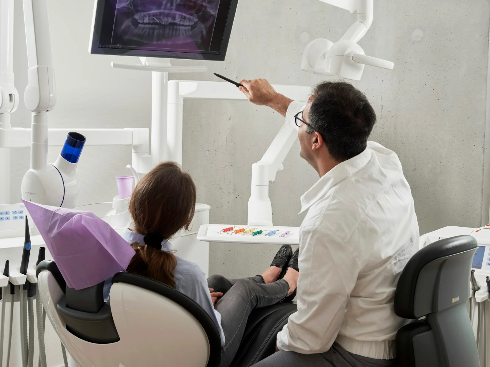 Smartphone showing a map of nearby dental clinics in a local search result