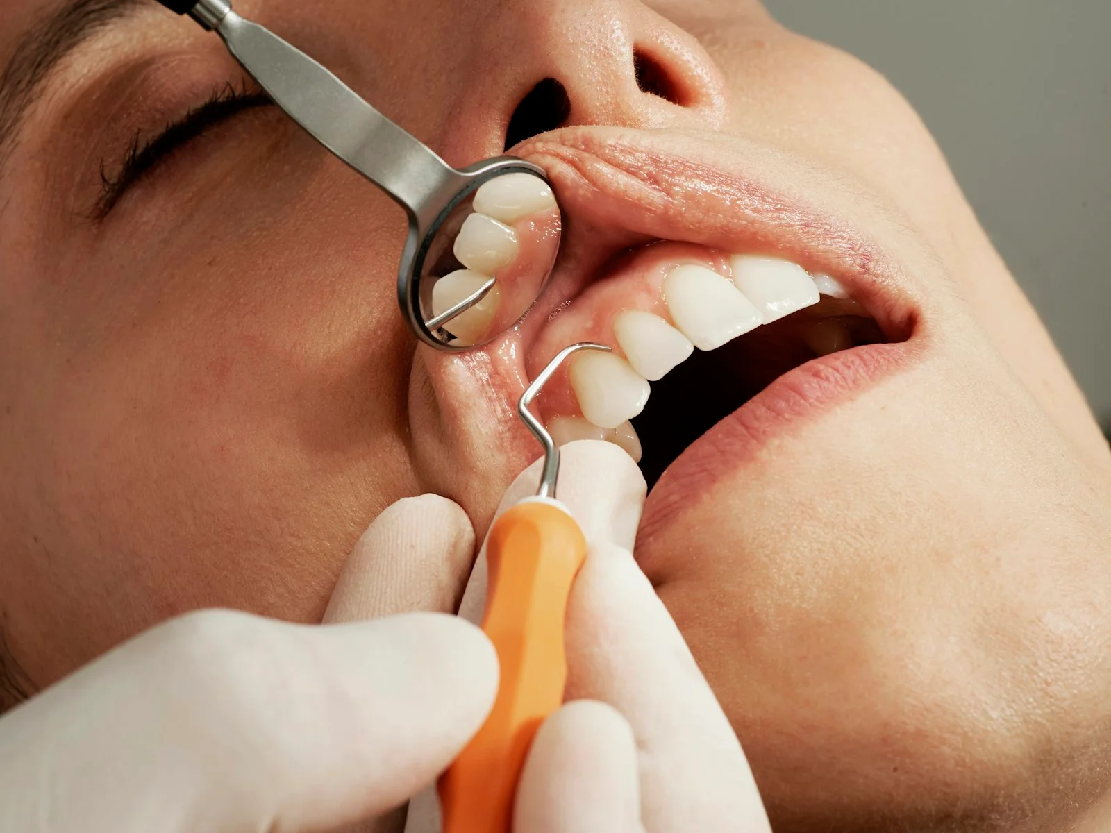 Welcoming modern dental reception area with a patient checking in